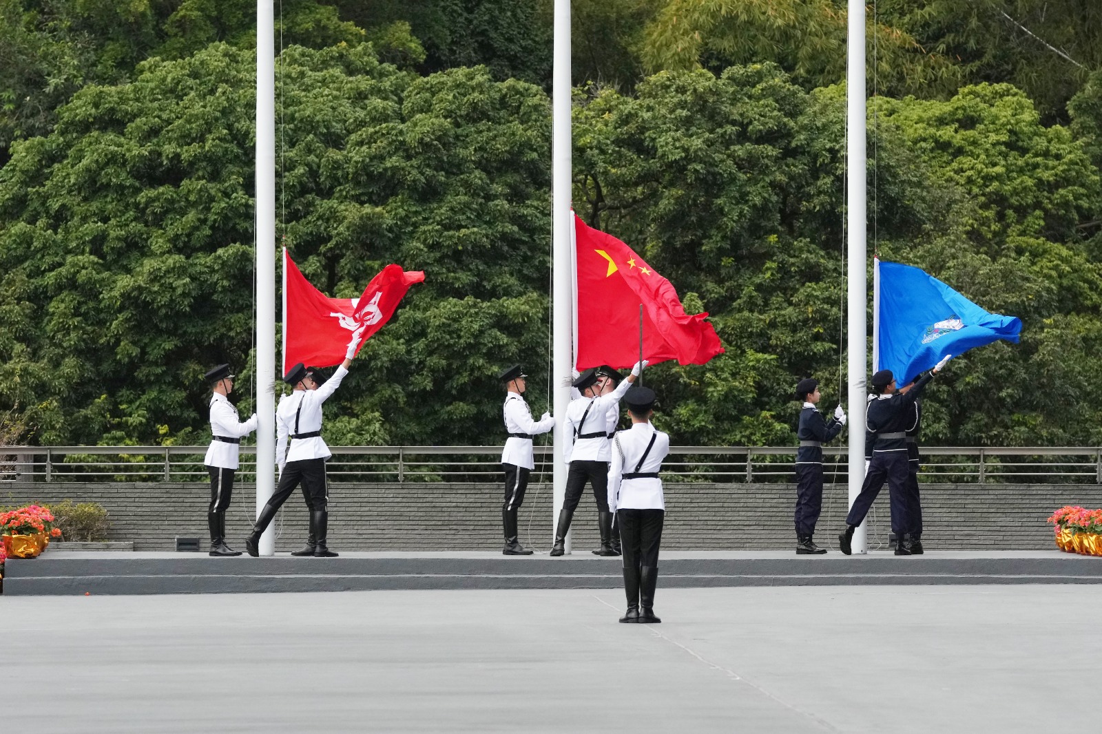 Flag raisers in the Immigration Department Youth Leaders Corps 10th Anniversary Grand Parade